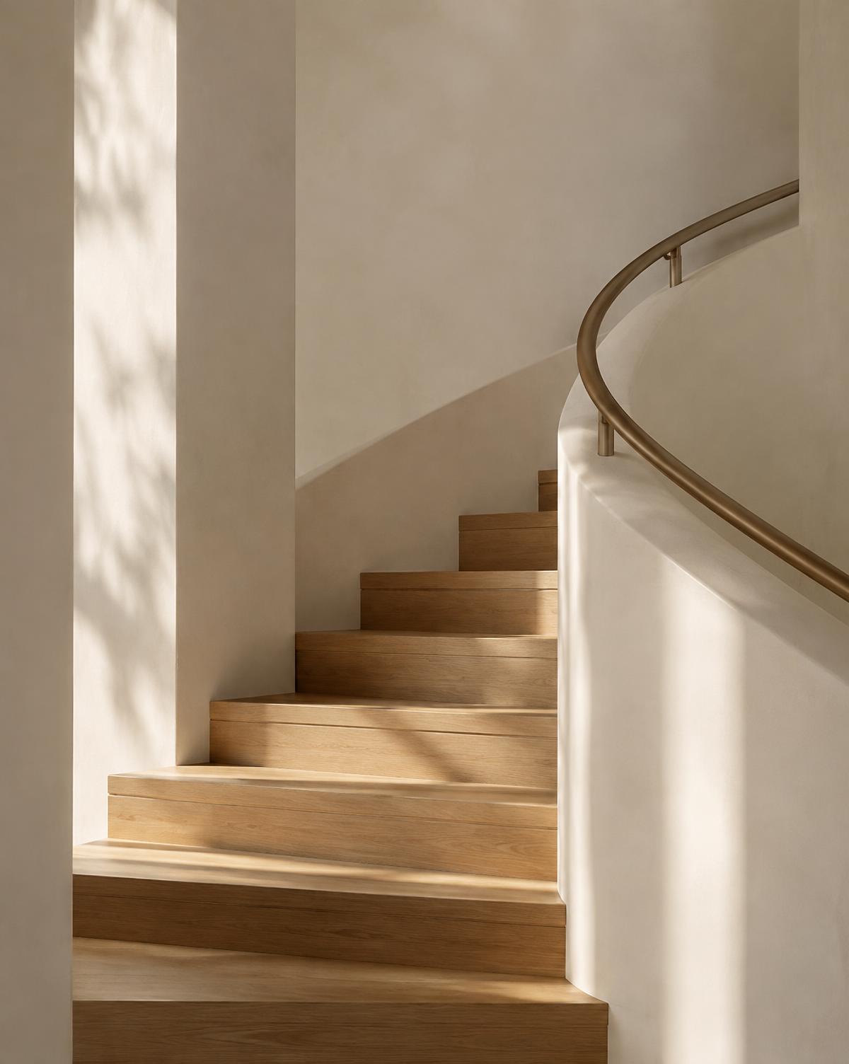 Minimal plaster staircase with oak treads and bronze handrail